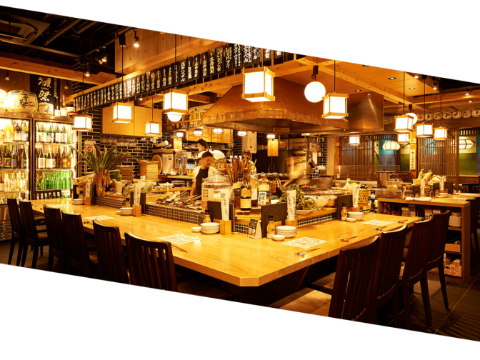 グループを象徴する活気あふれる賑やかな酒場のイメージ